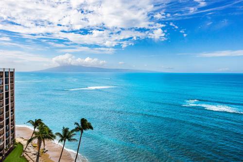 an aerial view of the ocean with palm trees at Royal Kahana 1212 in Kahana