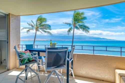 a dining room with a view of the ocean at Island Sands 311 in Wailuku