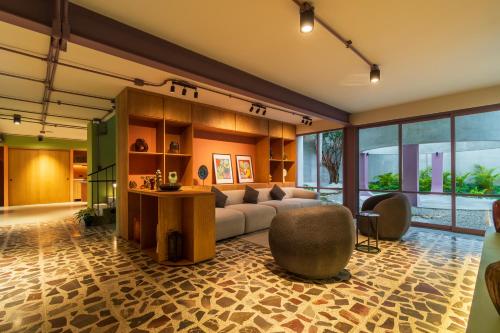 a living room with a couch and a table at Nico Hotel & Residences in Xalapa