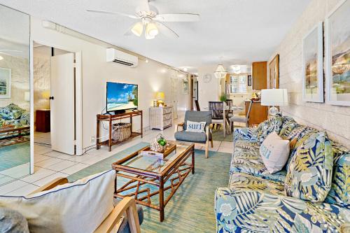 a living room with a couch and a table at Kanai A Nalu 214 in Wailuku