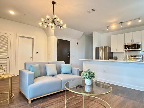 a living room with a couch and a table at New Downtown ATL Condo Washer Dryer 542Blvd107 in Atlanta