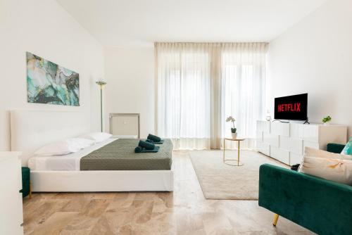 TV a/nebo společenská místnost v ubytování Appartamento vicino Milano, Como e MXP