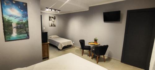 Et tv og/eller underholdning på Portal suítes Avenida Paraty