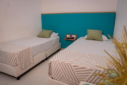 Postel nebo postele na pokoji v ubytování La Puerta del Ángel Isla