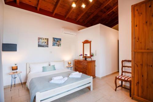 Postel nebo postele na pokoji v ubytování Villa Asteri