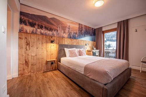 Кровать или кровати в номере Gästehaus Kaiserblick