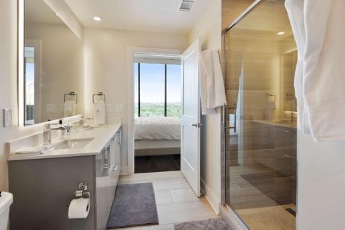 a bathroom with a shower and a sink and a toilet at Amazing Midtown 2 bdrm in Atlanta