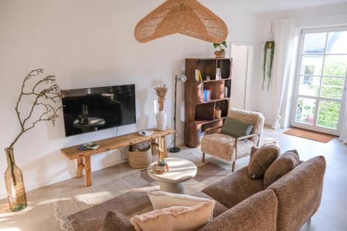 TV a/nebo společenská místnost v ubytování Zenkoje - Ihr Ferienzuhause in der Pfalz!