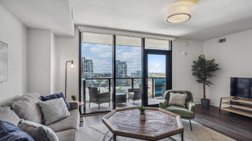 a living room with a couch and a table at Amazing Apt in Midtown in Atlanta