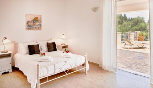 Postel nebo postele na pokoji v ubytování Monodendri Blue