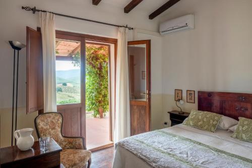 Ένα ή περισσότερα κρεβάτια σε δωμάτιο στο Podere Cavone - Casale degli Ulivi