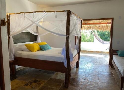 Ein Bett oder Betten in einem Zimmer der Unterkunft Pousada Casinha Branca