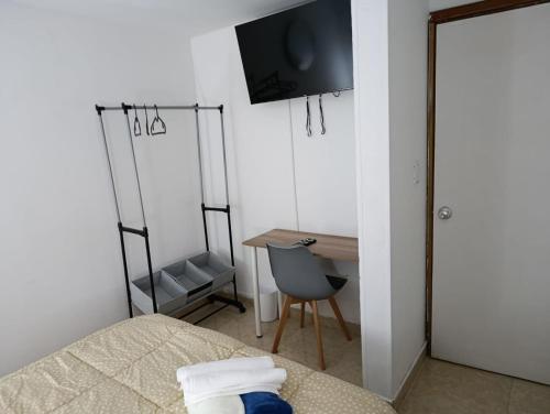 TV a/nebo společenská místnost v ubytování Colitalia Apartments