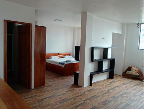 Ένα ή περισσότερα κρεβάτια σε δωμάτιο στο Akasha Galápagos