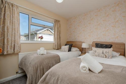 En eller flere senge i et værelse på Moorland Bungalow Central Clitheroe