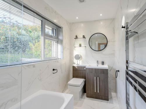 a bathroom with a sink toilet and a mirror at 2 Bed in Wareham oc-79228 in West Lulworth