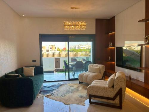 Фотография из галереи Appartement chic a 5 mins de la plage в городе Эль-Хархура