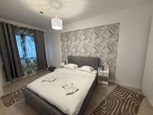 En eller flere senge i et værelse på Ivory Luxury 1BR