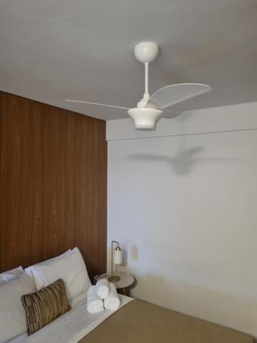 Ένα ή περισσότερα κρεβάτια σε δωμάτιο στο Studio novo com ambiente acolhedor