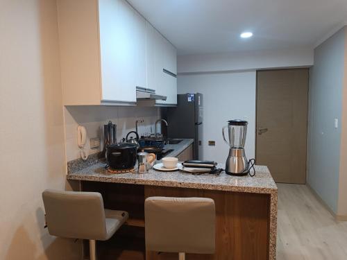 Кухня или мини-кухня в Comfortable apartment in Parque la Reserva
