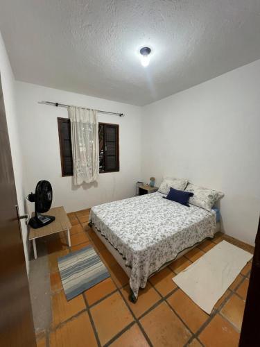 En eller flere senge i et værelse på Chale a 80 metros da praia de Maresias