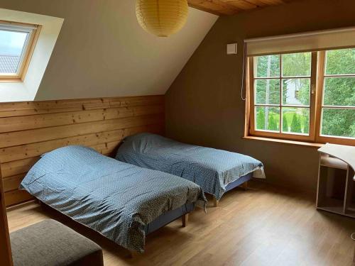 Ένα ή περισσότερα κρεβάτια σε δωμάτιο στο Kasekuma House with all comforts well located