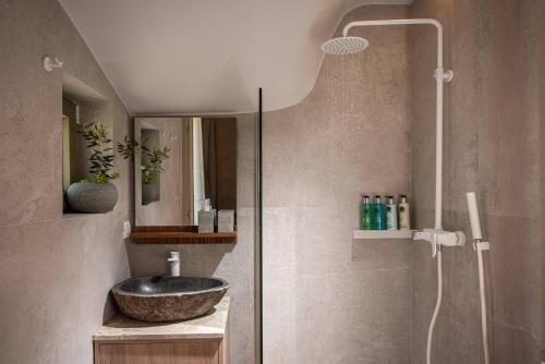 a bathroom with a sink and a shower at Villa Alquimia Aa with private Swimming pool in Hersonissos