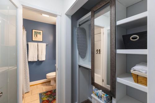 a bathroom with a toilet and a mirror at Condo in the Heart of Nashville - unit794 in Nashville