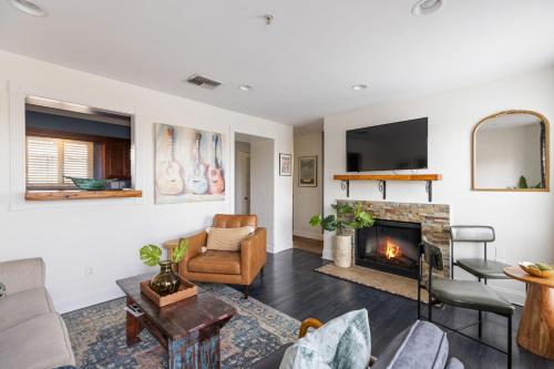 a living room with a couch and a fireplace at Condo in the Heart of Nashville - unit794 in Nashville