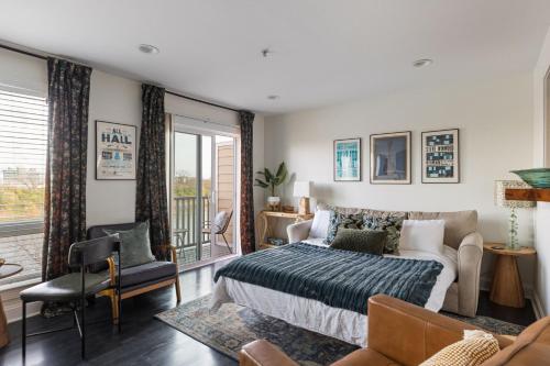 a bedroom with a bed and a couch at Condo in the Heart of Nashville - unit794 in Nashville