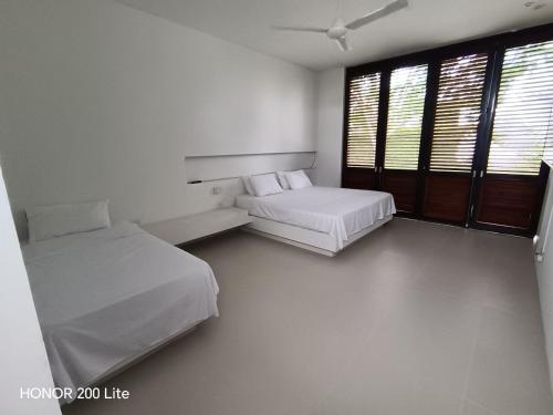 Ένα ή περισσότερα κρεβάτια σε δωμάτιο στο casa campestre igua