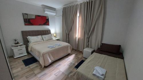 Ένα ή περισσότερα κρεβάτια σε δωμάτιο στο Casa Alegre Beach House