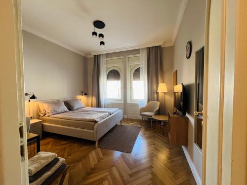 En eller flere senge i et værelse på Decebal Relax Room