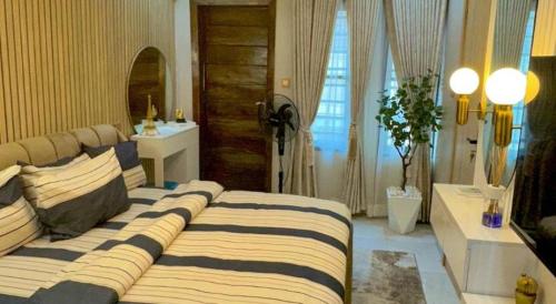 Postel nebo postele na pokoji v ubytování Raj Holidays Homes