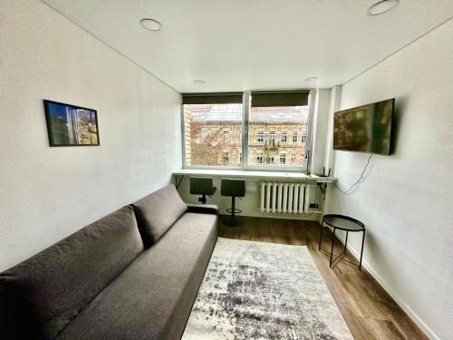 Et opholdsområde på Комфортная современная студия в центре