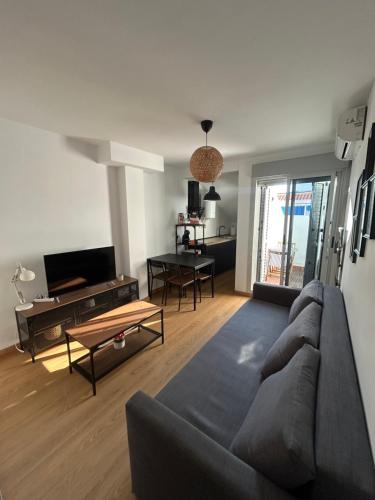 Телевизор и/или развлекательный центр в Apartamento Punta Umbría junto a la Ría