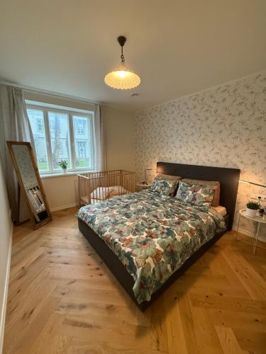 En eller flere senge i et værelse på Cozy Stay Apartment