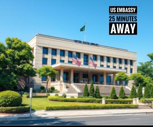 a building with two american flags in front of it at Luxurious 2 Bed Apartment in Islamabad