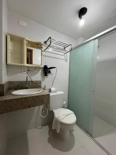 a bathroom with a toilet and a sink and a shower at ISRAEL FLAT TAMBAÚ - 102 in João Pessoa