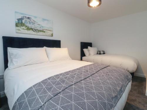 En eller flere senge i et værelse på The Farm House