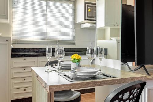 Køkken eller tekøkken på Residencial Lares do Rosa