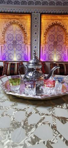 a tray with a tea pot on a table at Anza Lighthouse in Agadir