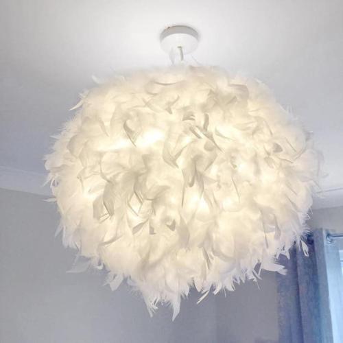 a large white chandelier hanging from a ceiling at Millwalk Apartment in Witney