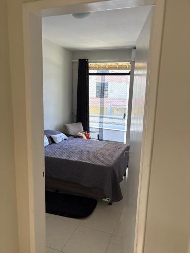 Ένα ή περισσότερα κρεβάτια σε δωμάτιο στο Residencial Orla de Atalaia