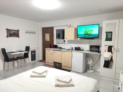 Kuchyň nebo kuchyňský kout v ubytování Studio indépendant à Grône