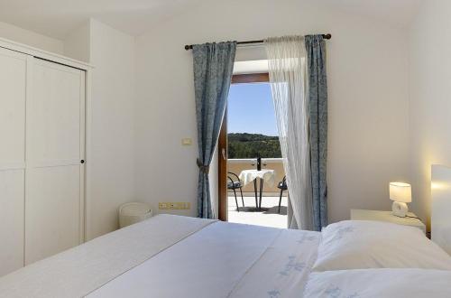 a bedroom with a bed and a window with a view at Villa Beram in Pazin