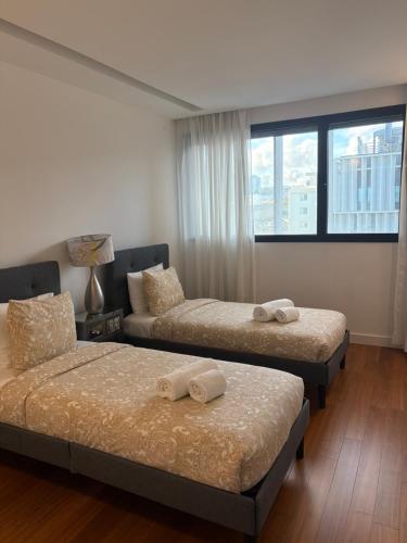 Ένα ή περισσότερα κρεβάτια σε δωμάτιο στο S.Soares T3 Expo Sul