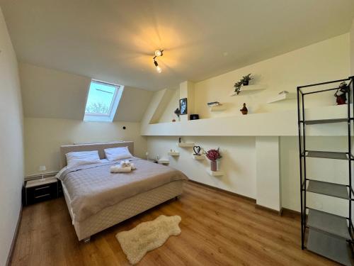 a bedroom with a bed with a stuffed animal on it at Gusterita Hideaway in Sibiu