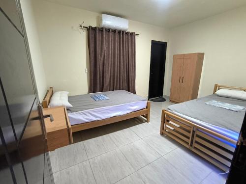 Ένα ή περισσότερα κρεβάτια σε δωμάτιο στο شاليه 3 غرف Lasirena Mini Egypt Resort Ain Sokhna Families only