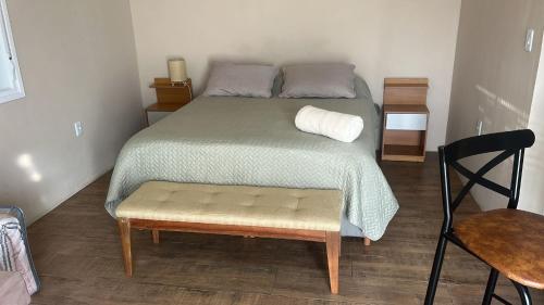 Ένα ή περισσότερα κρεβάτια σε δωμάτιο στο Los Kinotos Mini Casa Chuy